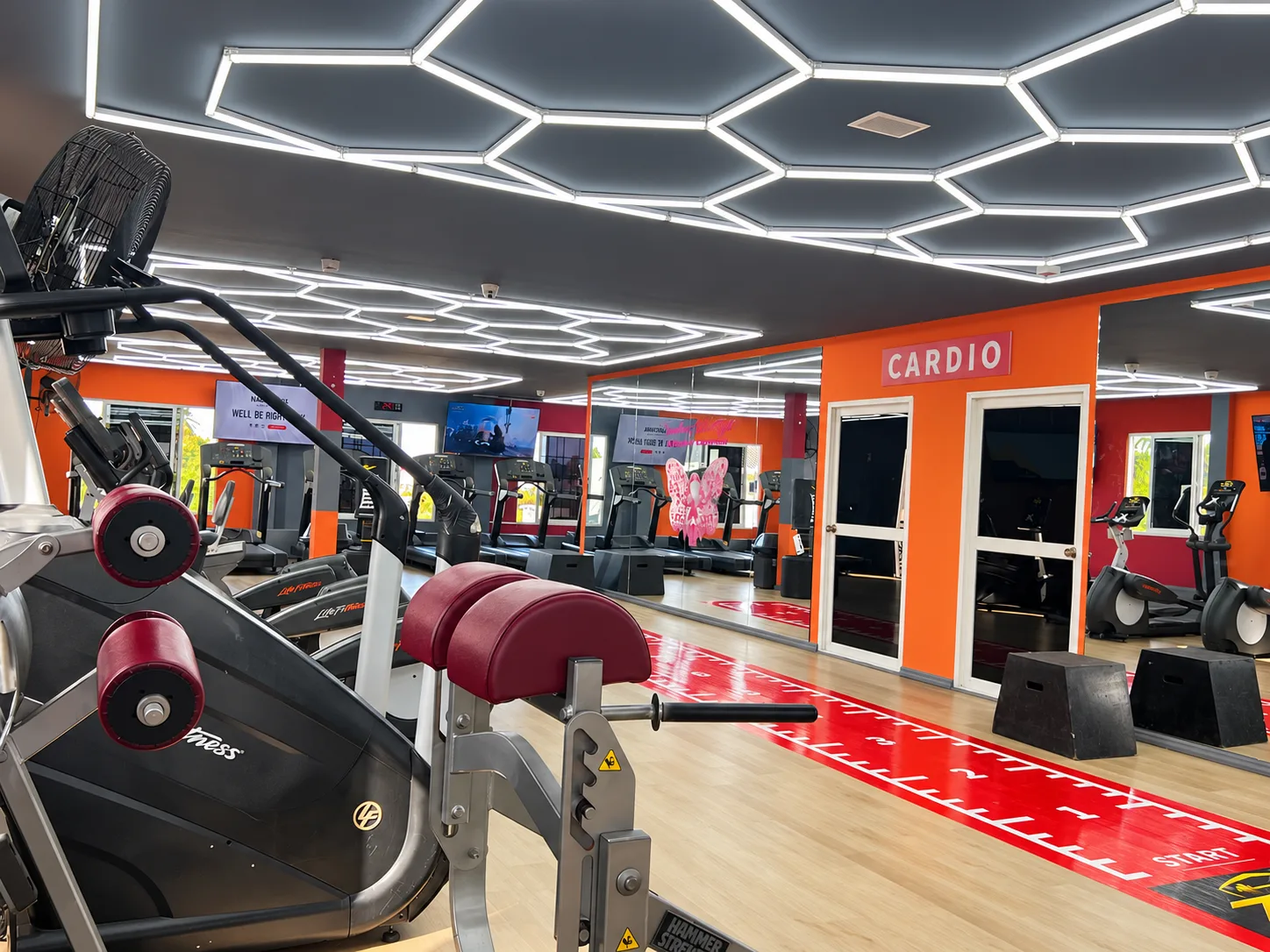 Weight machines and cardio equipment at Triple Zee
